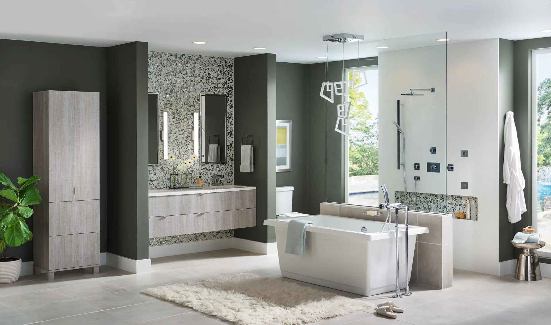 A bathroom with a double vanity, freestanding tub, and tiled shower, from the Medallion cabinet line we carry