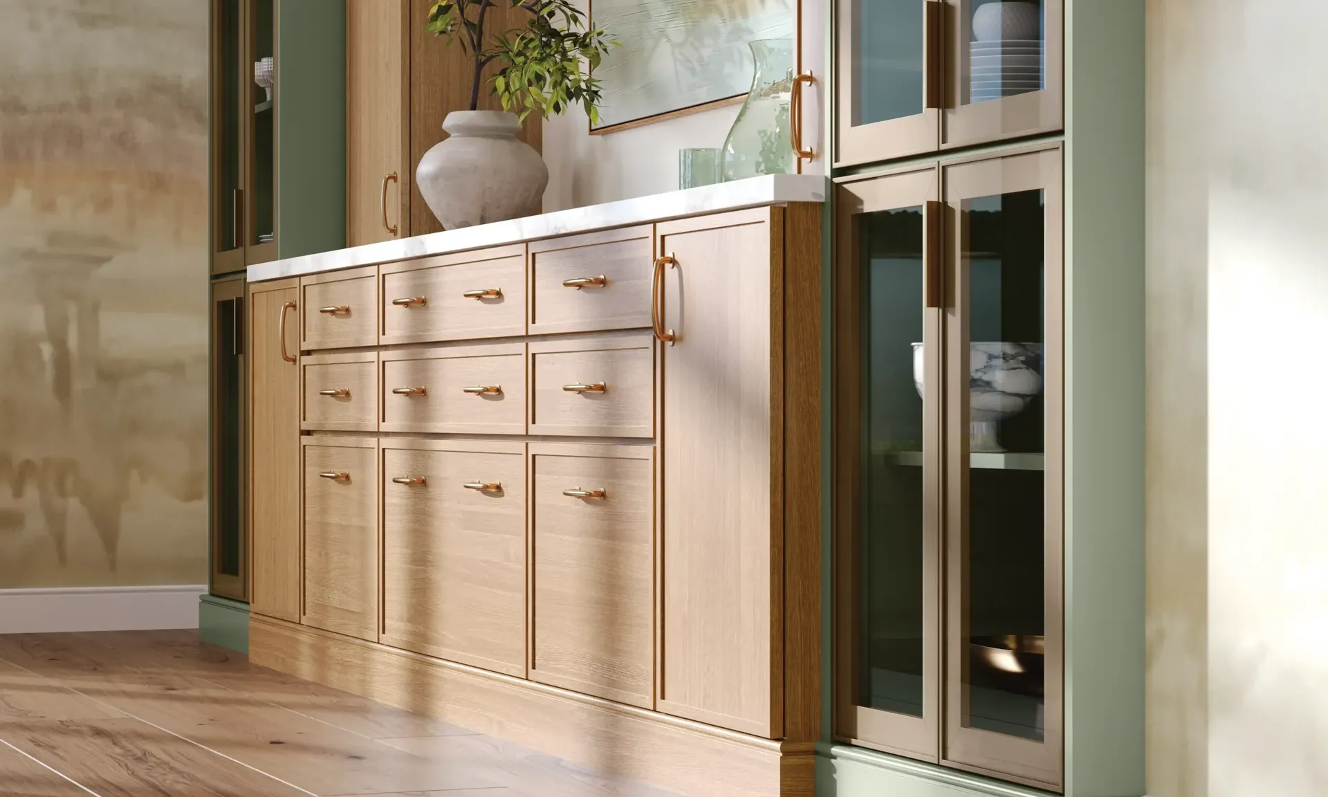 A kitchen with wood cabinets and glass upper doors, from the Medallion cabinet line we carry