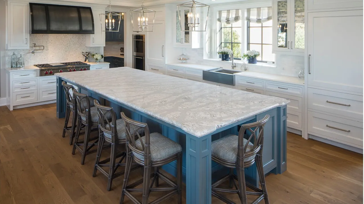 A kitchen island with a quartz countertop, from the Cambria quartz line we carry