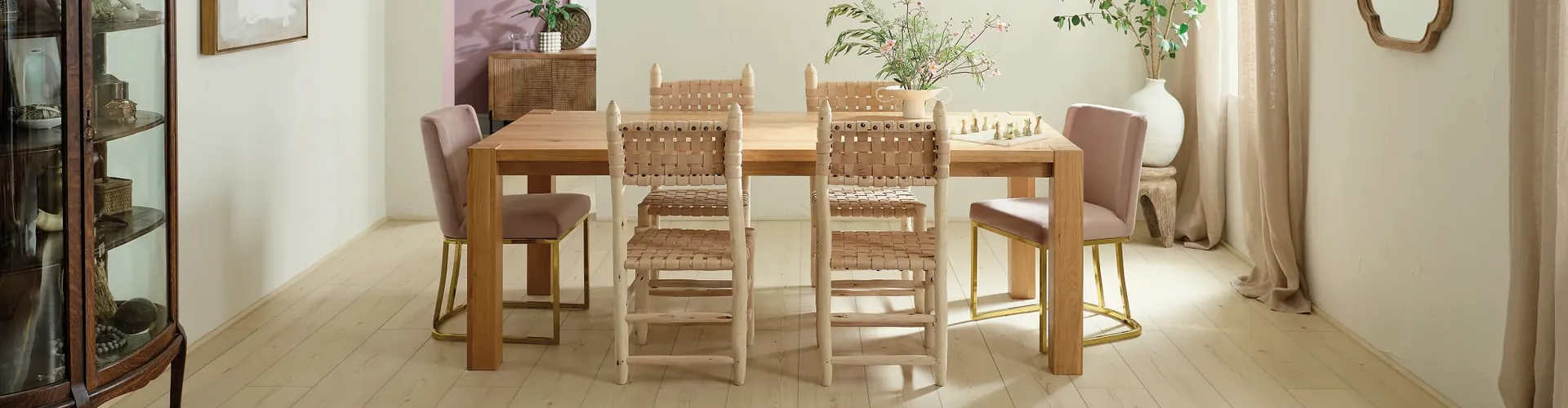 Light wood-look luxury vinyl plank flooring by COREtec, product UV927, in a dining room