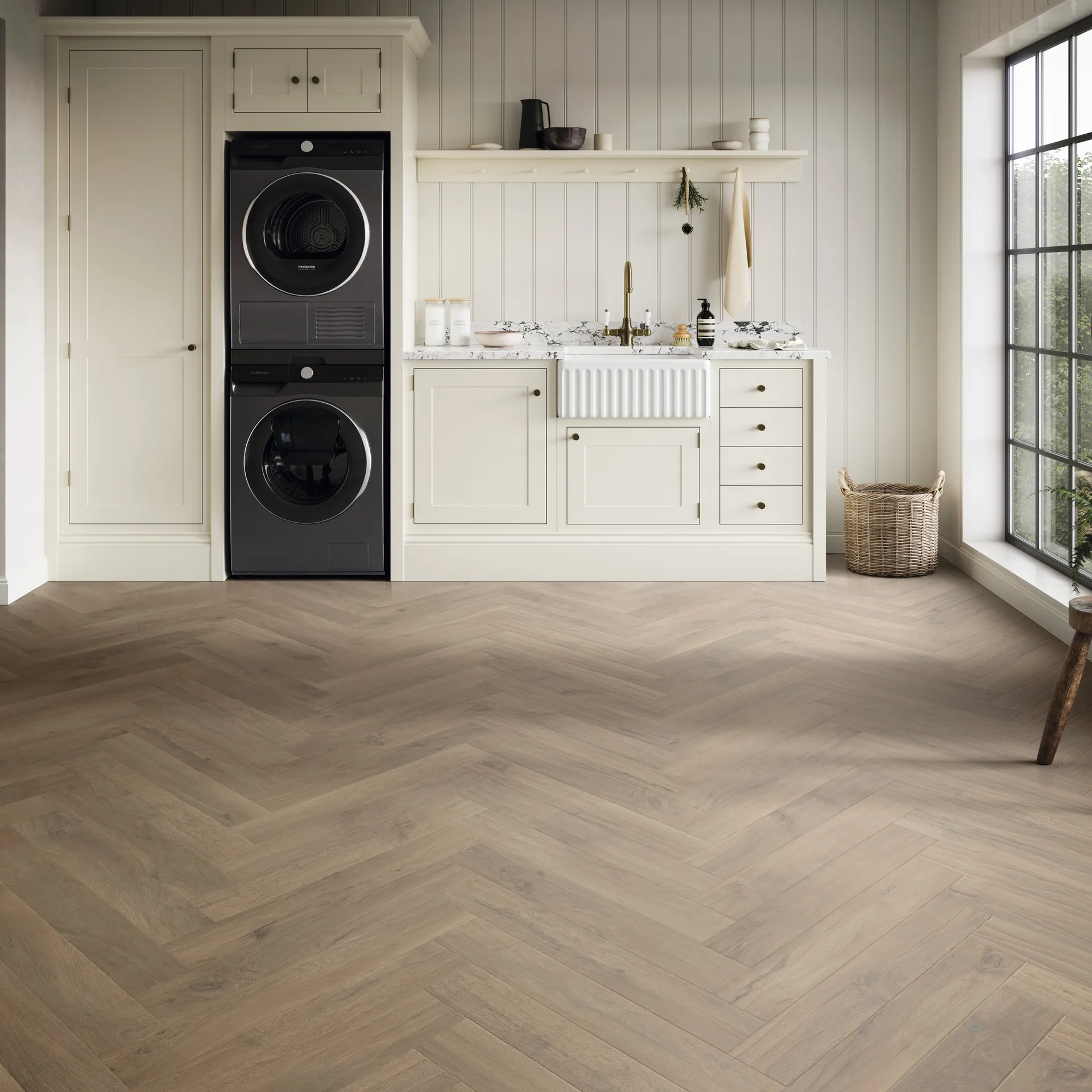 Herringbone wood-look luxury vinyl flooring by Karndean, Art Select Salon Oak, in a laundry room
