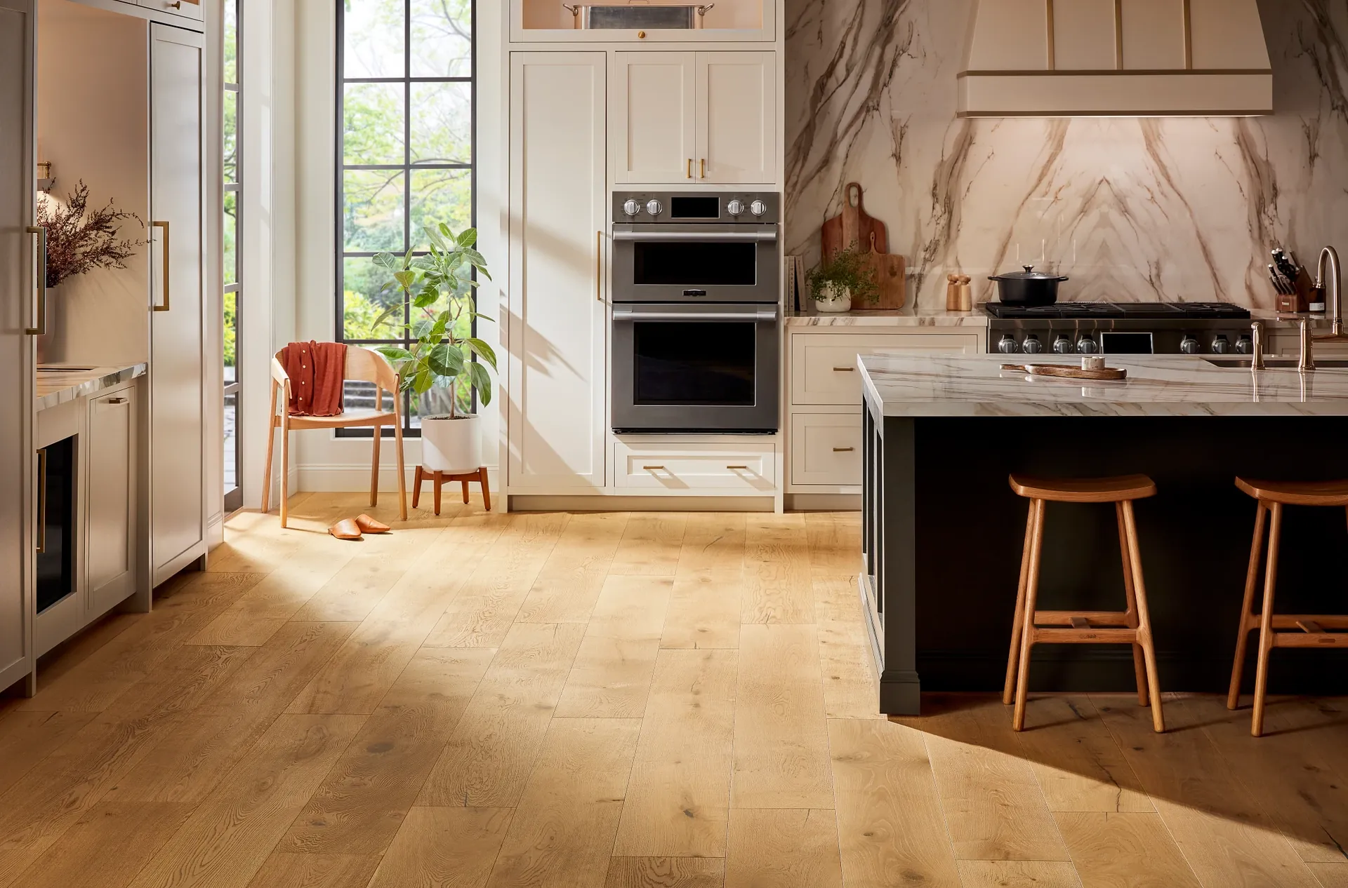 Light engineered hardwood flooring by Anderson Tuftex, Grand Estate Thorndon Hall, in a sunlit kitchen