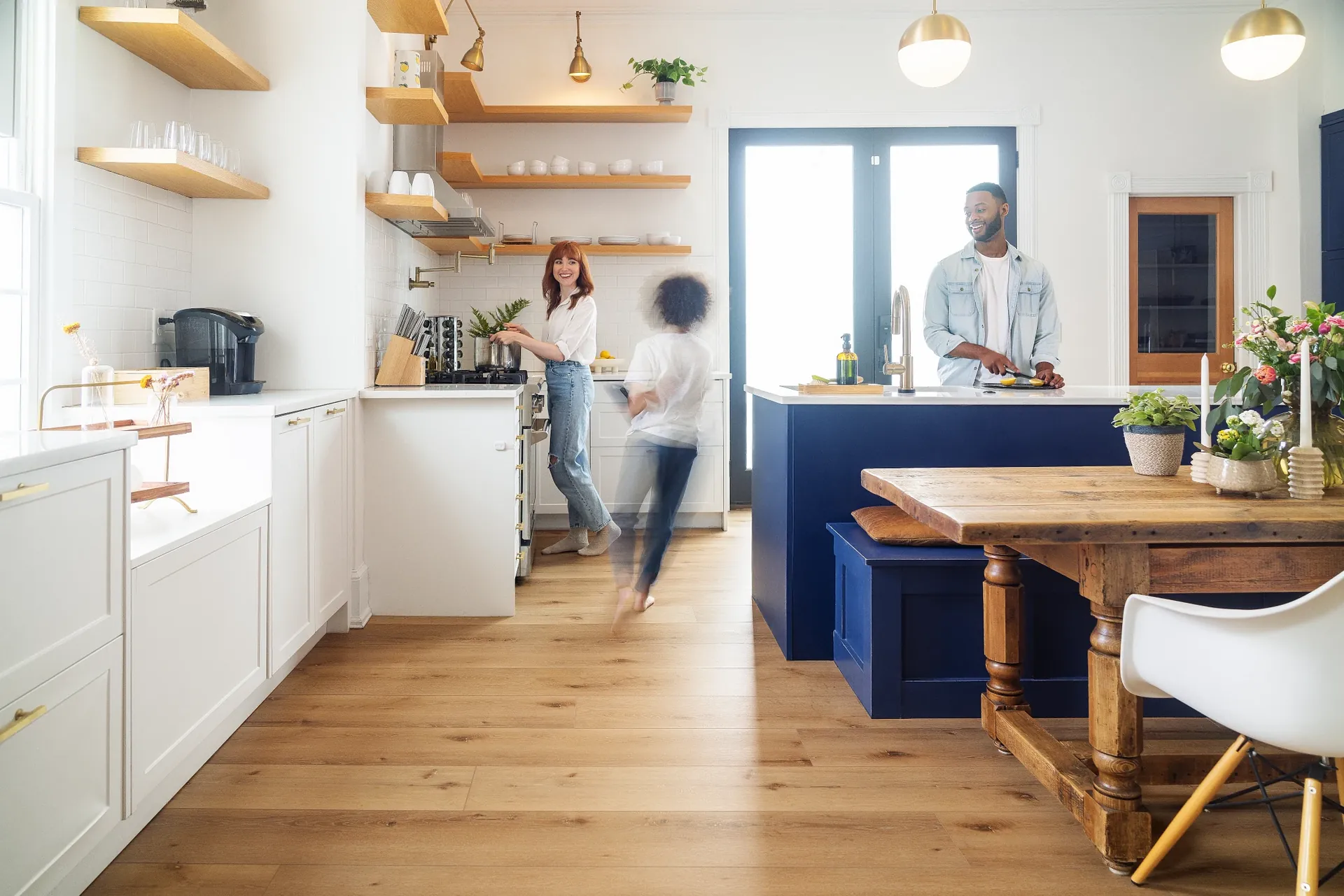Wood-look luxury vinyl plank flooring by COREtec, product UV891, in a family kitchen