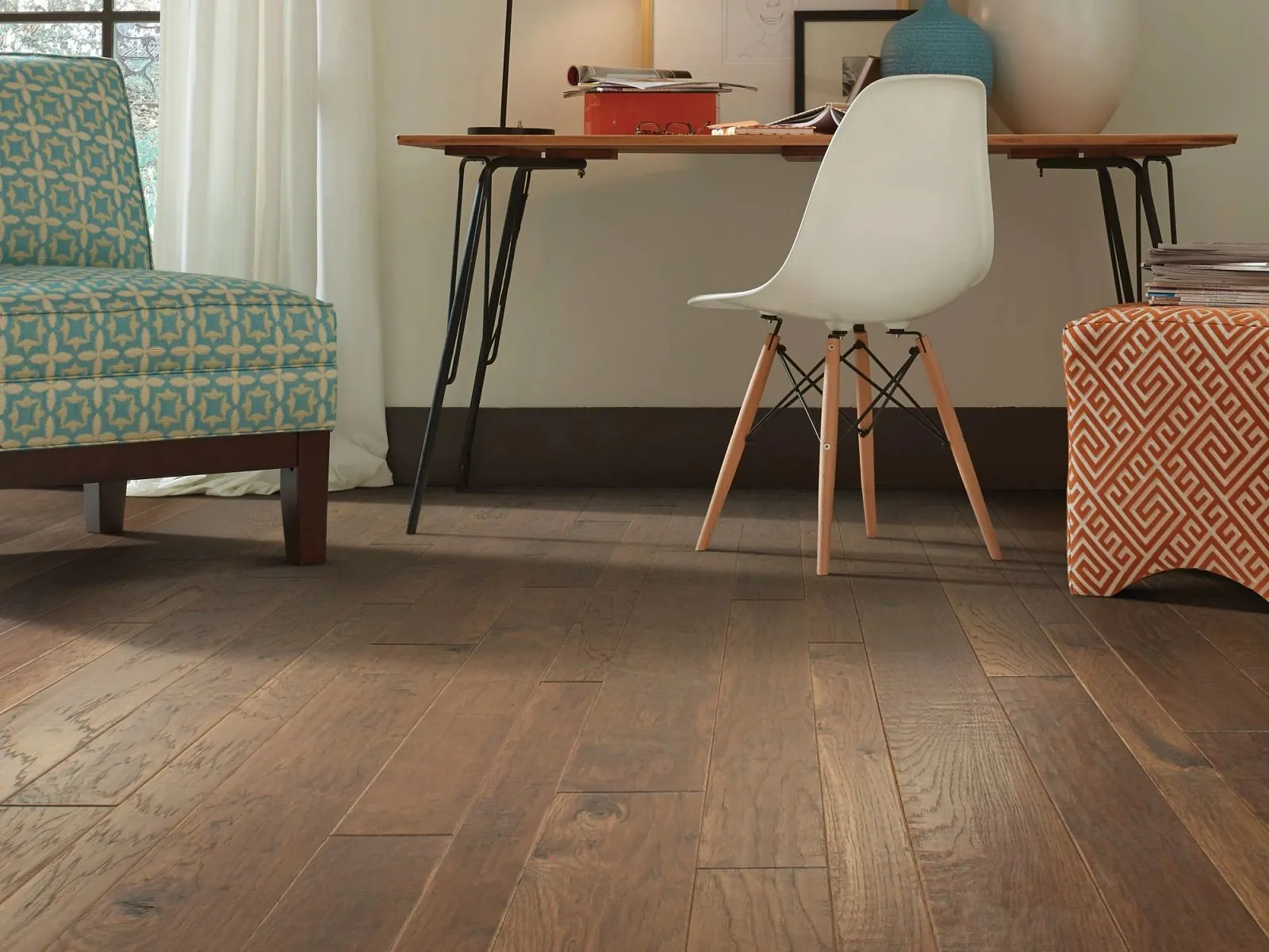 Warm hand-scraped hickory hardwood flooring in a home office, from the Shaw hardwood line we carry