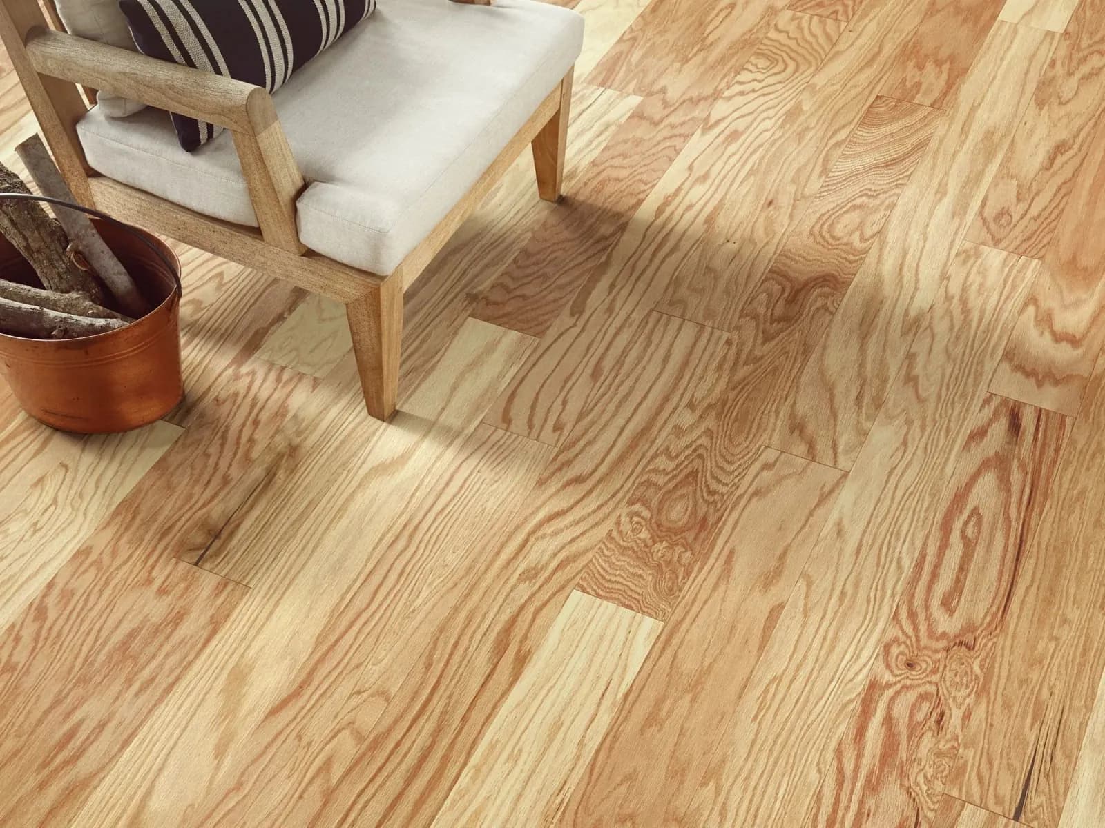 Light red oak hardwood flooring in a bright living room, from the Shaw hardwood line we carry