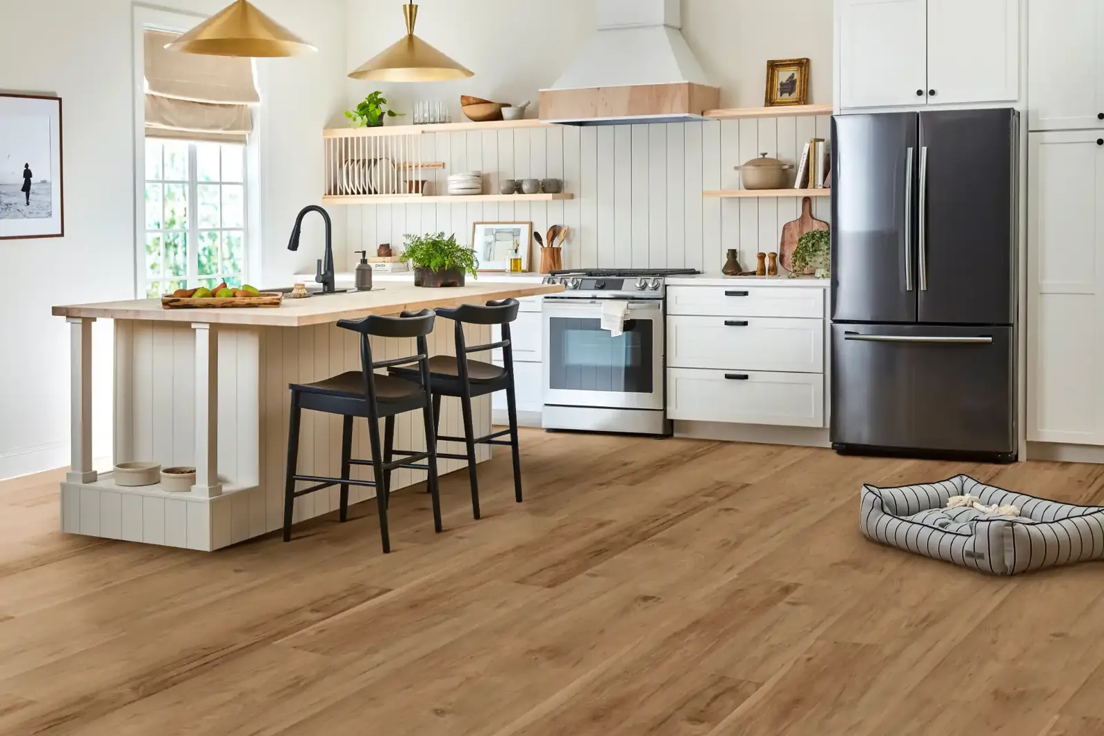 Warm brown luxury vinyl plank in a white kitchen, where deeper tones feel cozier but visually smaller