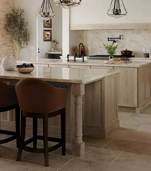 Warm rift-oak kitchen cabinets with a light stone island, one of the cabinet looks Blackburn's Interiors offers Davenport, FL homeowners, family-owned since 1962