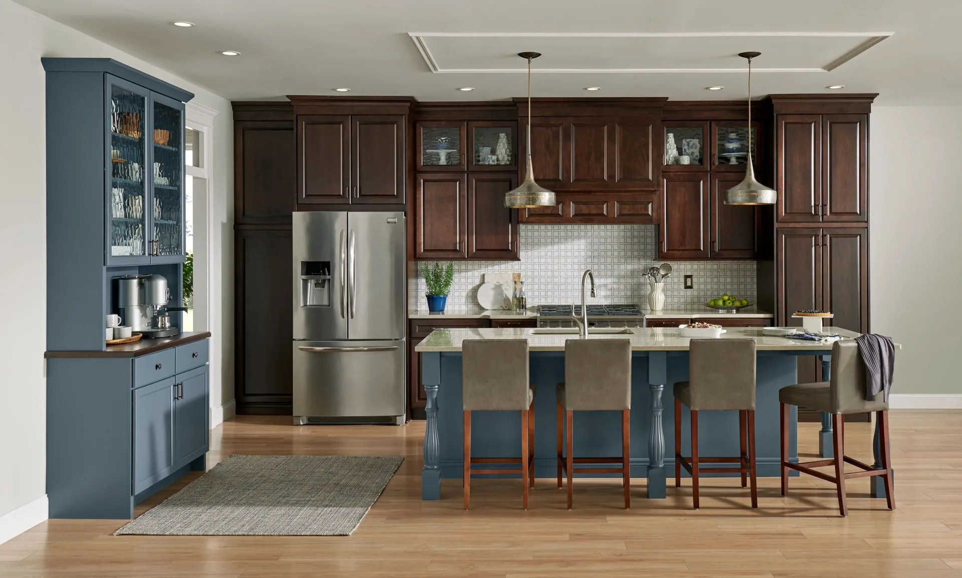 Medallion Jackson raised panel cabinets in a kitchen with a blue island, a Medallion kitchen scene from our cabinet line
