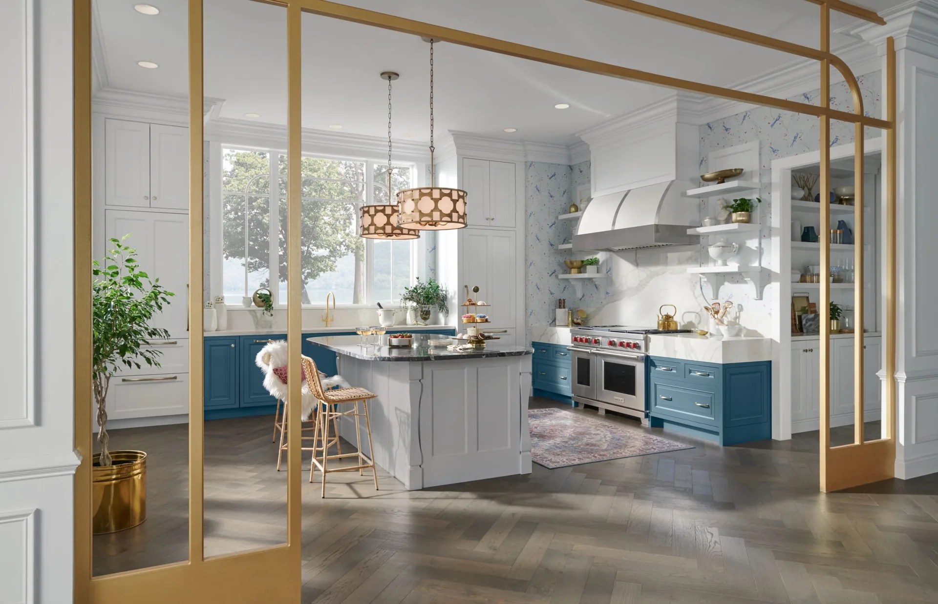 Medallion Providence Flat Panel cabinets in a bright kitchen with a blue island and brass details, from our Medallion line