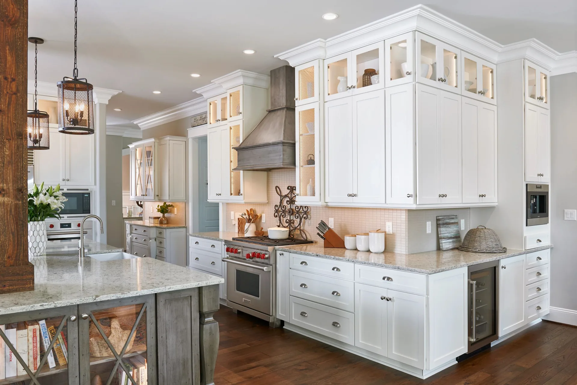 Medallion Potter's Mill Flat Panel shaker style cabinets in a painted white kitchen with a contrasting island, from our Medallion line