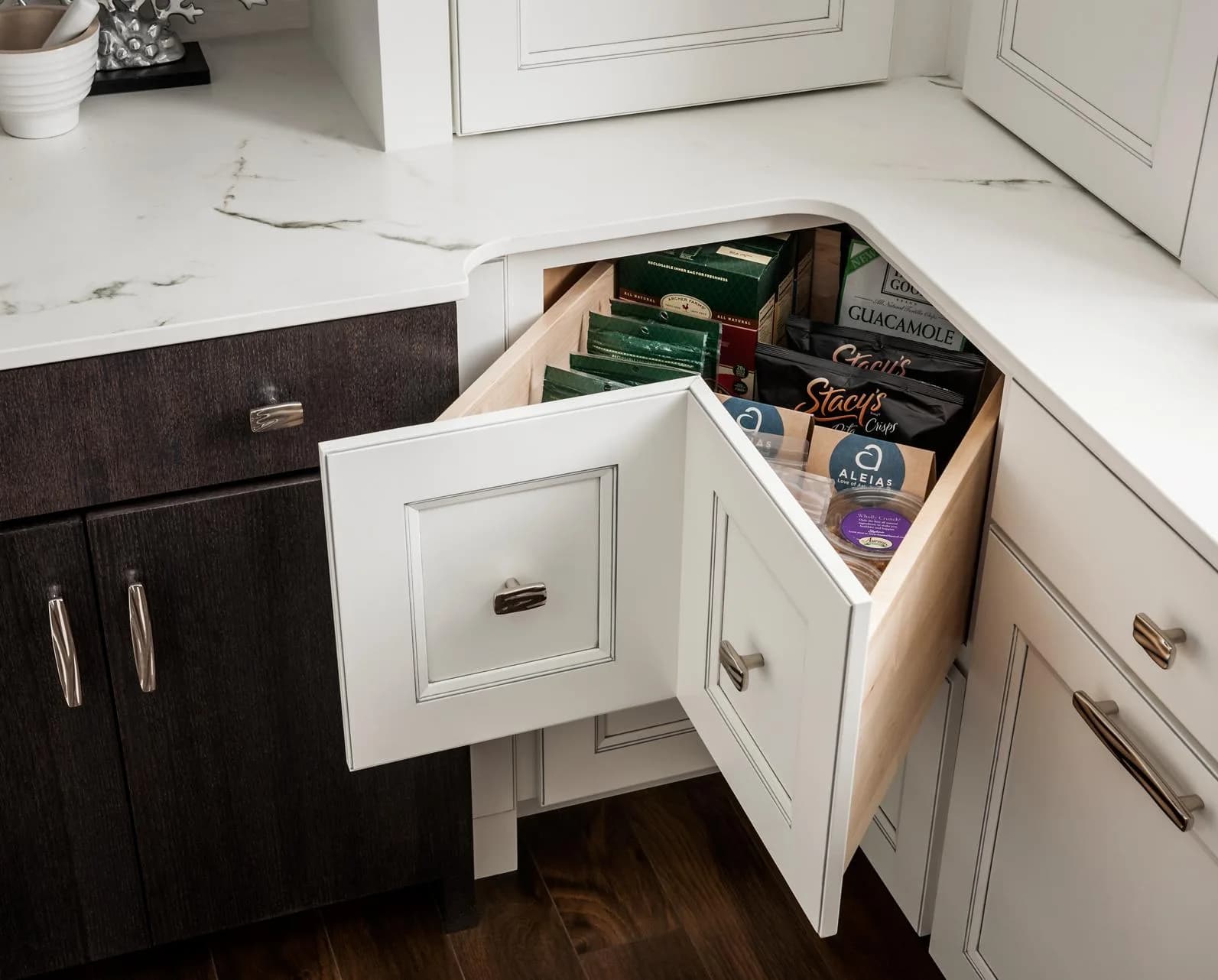 Medallion's angled corner drawer base open at the kitchen corner, turning dead space into drawers
