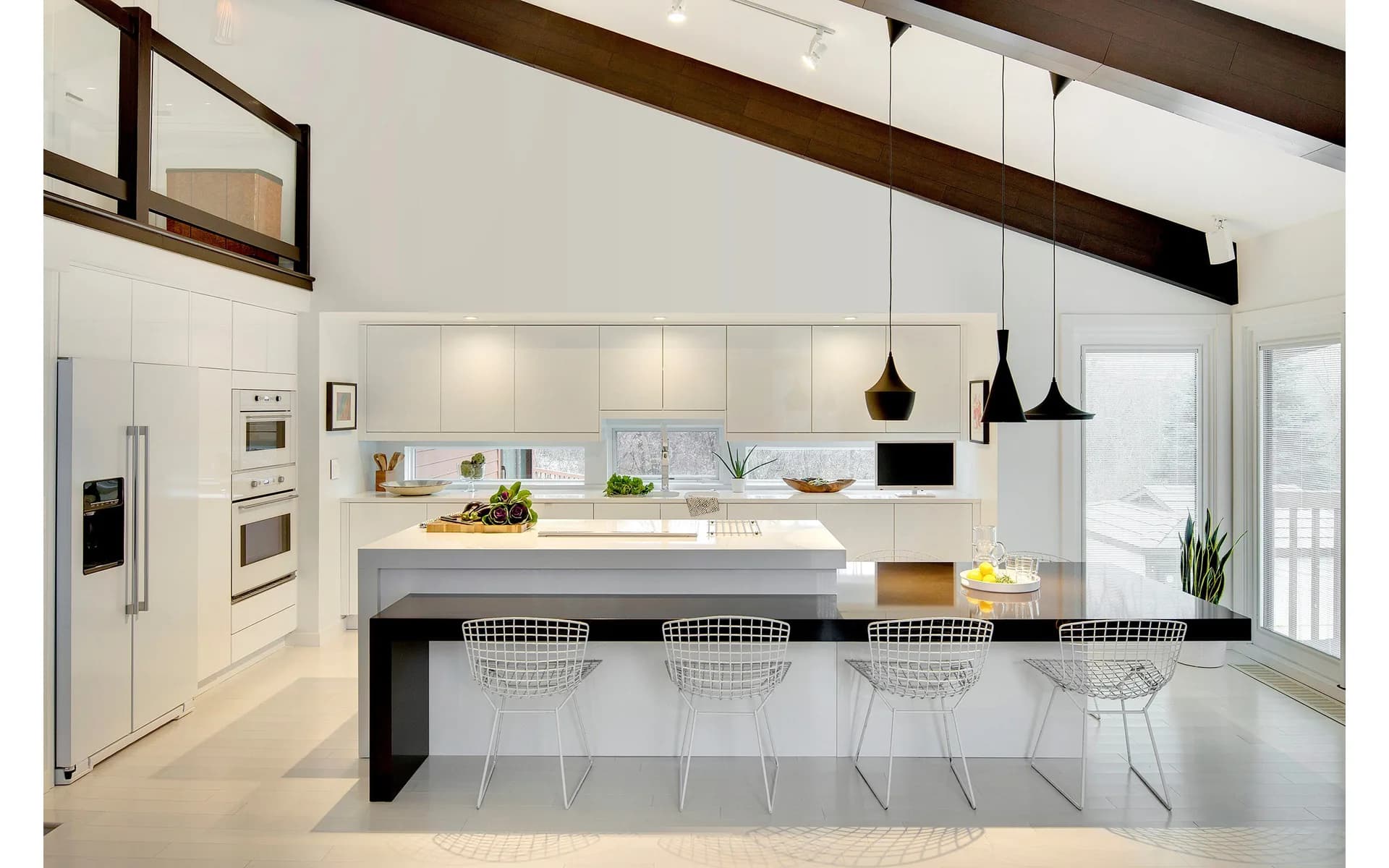 Cambria White Cliff and Cambria Black quartz countertops in a modern kitchen, from the Cambria line we carry