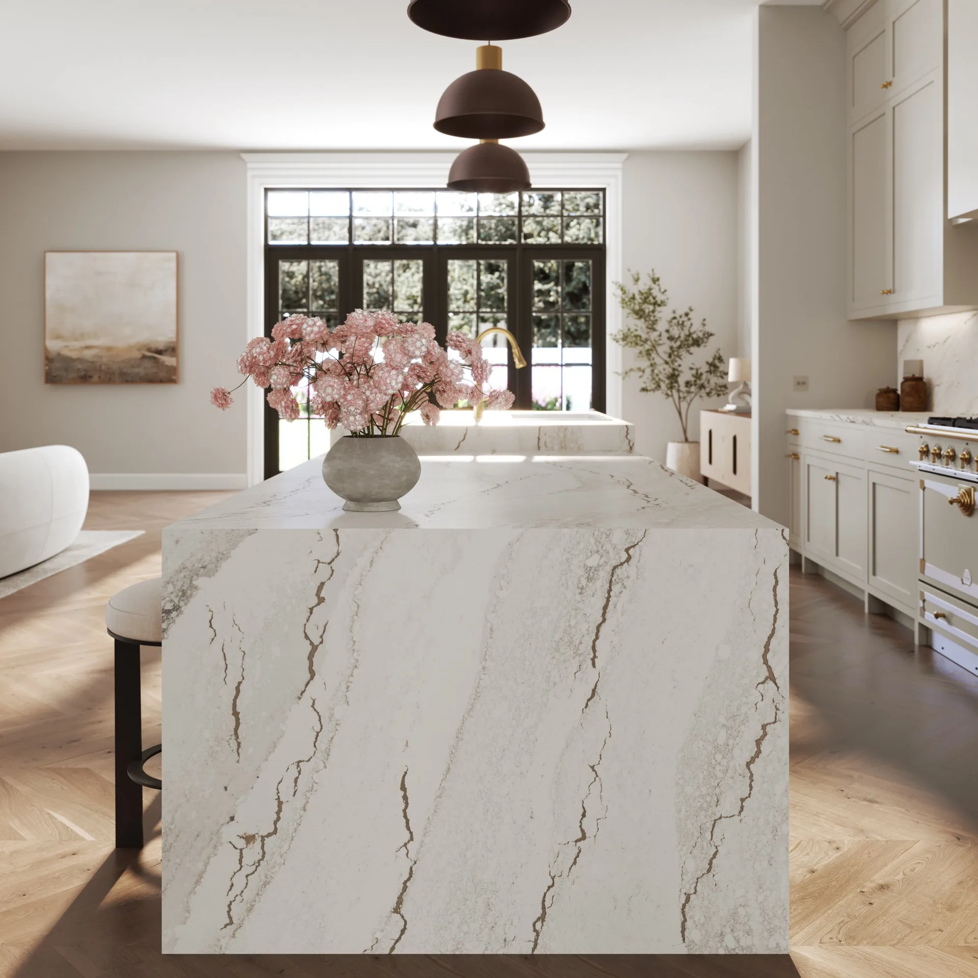 Cambria Inverness Blakeley quartz island countertop in a warm white kitchen, from the Cambria line we carry