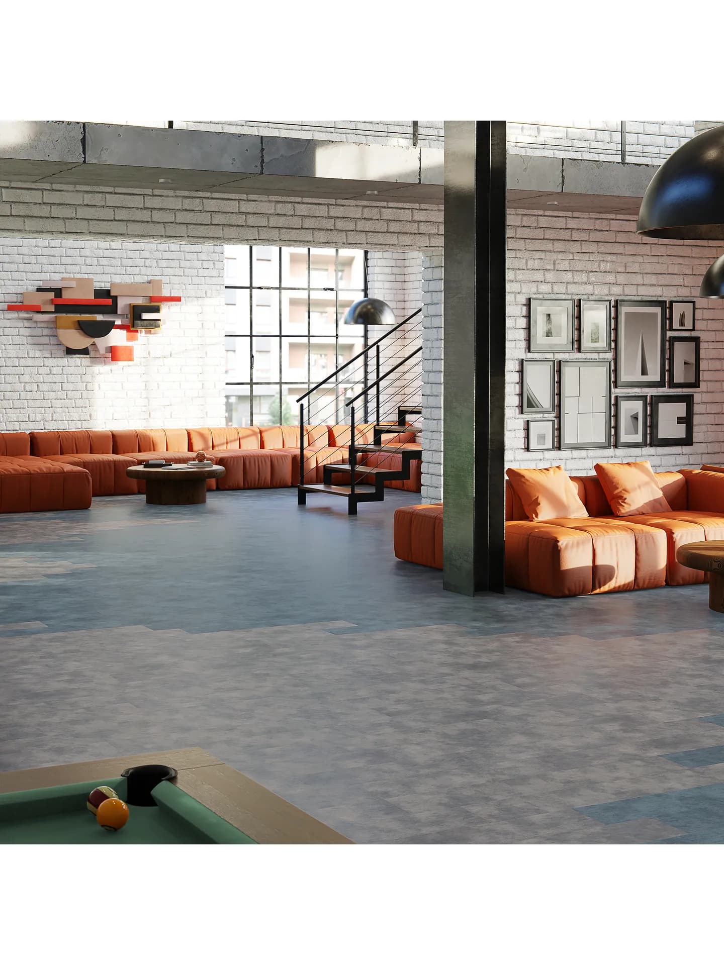 Philadelphia Commercial modular tile flooring in mottled blue gray, staggered across a loft lounge with orange modular seating and a pool table.