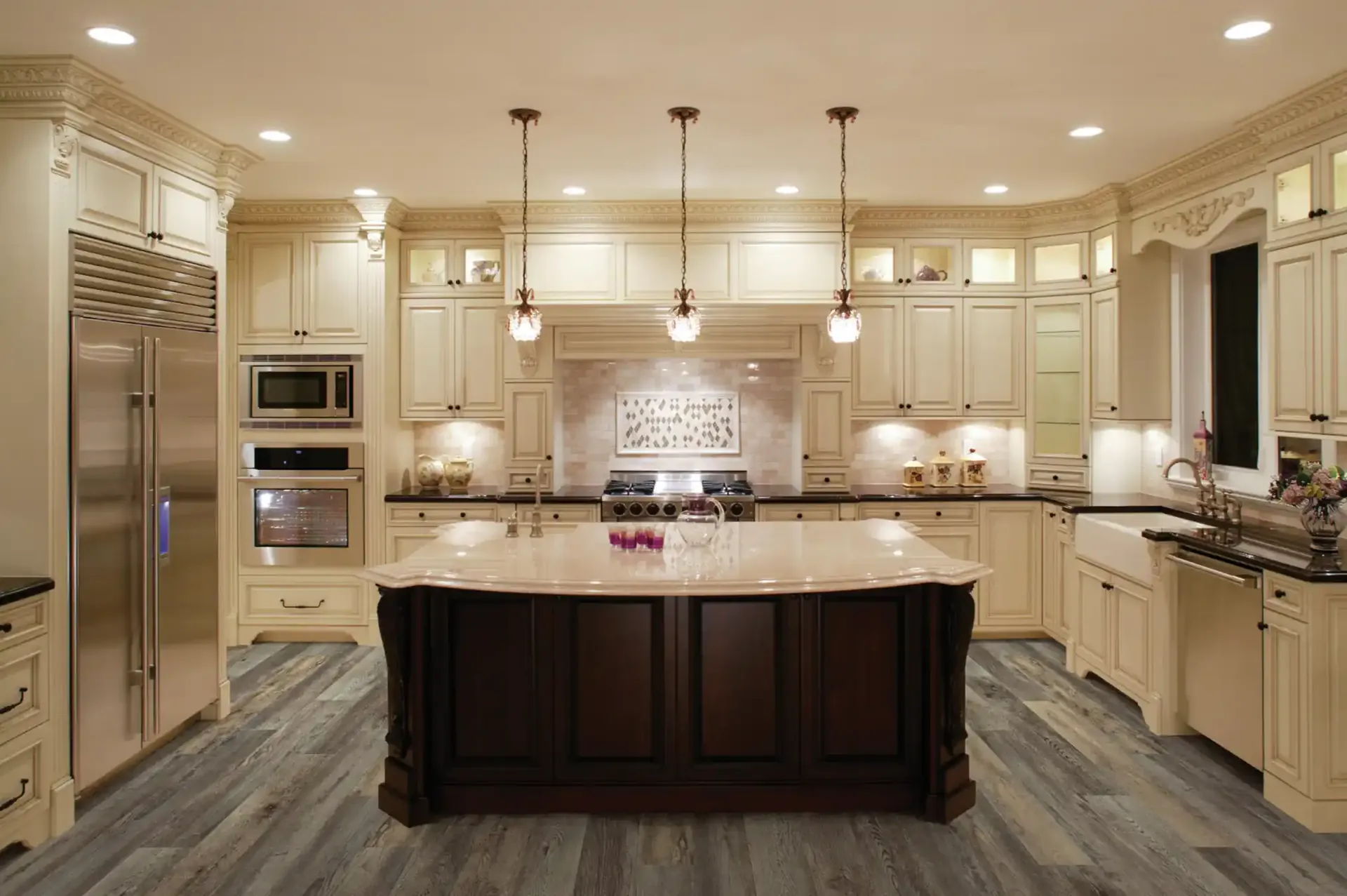 COREtec Plus Enhanced plank in Galathea Oak in a cream traditional kitchen. Carried by Blackburn's Interiors, Winter Haven, FL