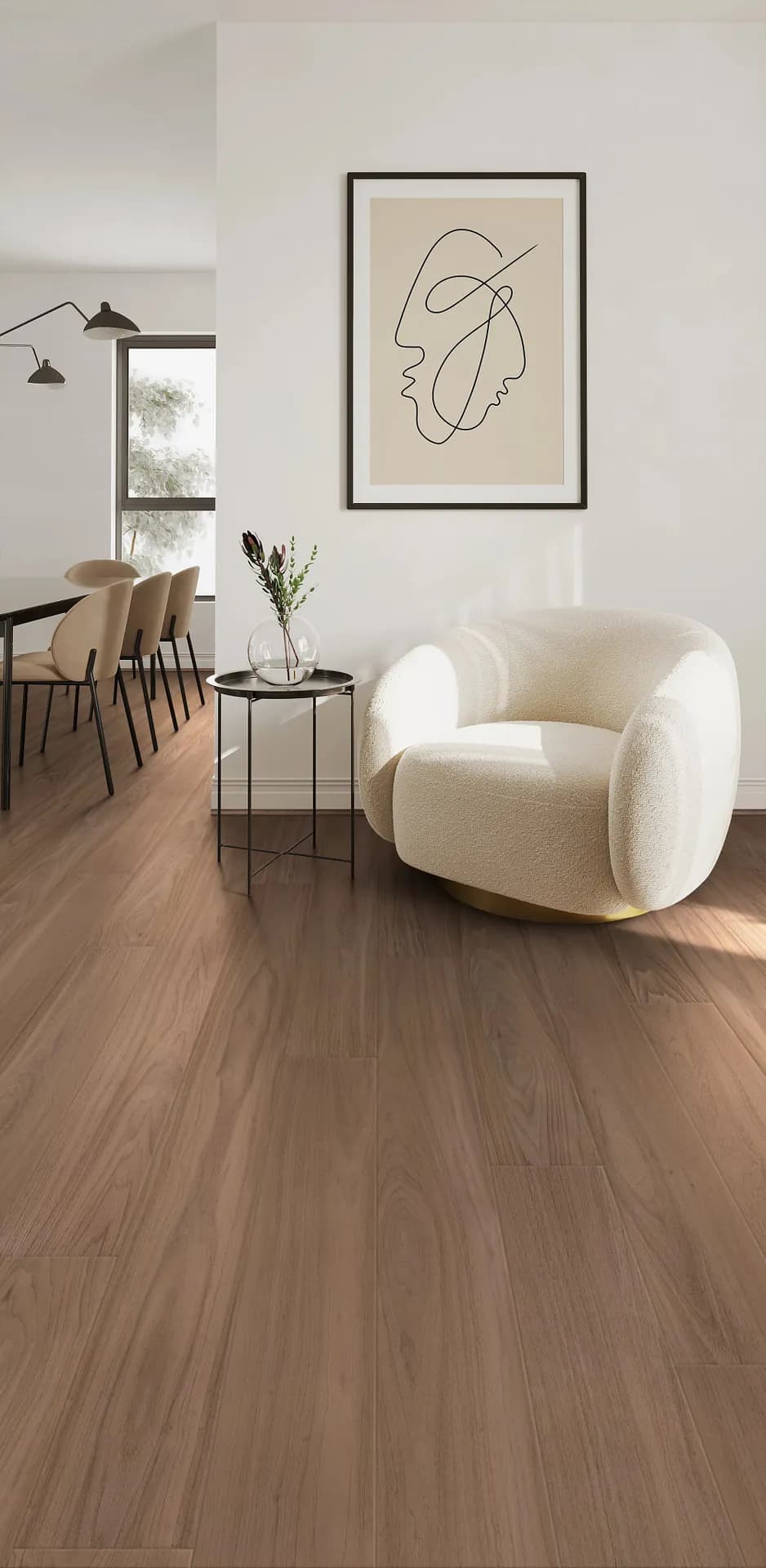 COREtec luxury vinyl plank under a cream armchair in a reading corner. Carried by Blackburn's Interiors, Winter Haven, FL