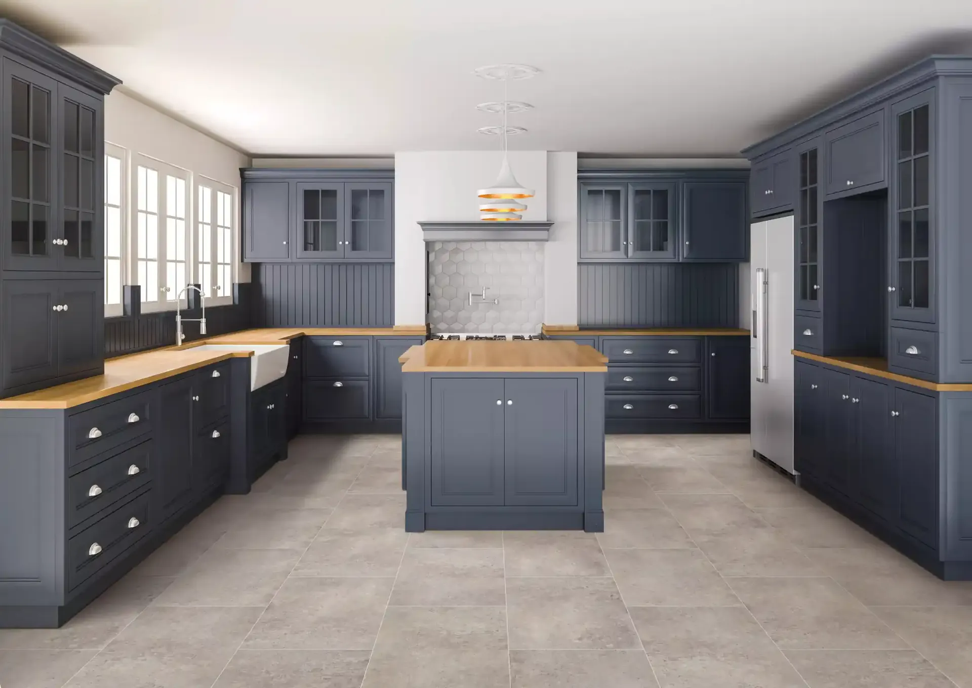 COREtec Stone luxury vinyl tile in Murcia in a navy shaker kitchen. Carried by Blackburn's Interiors, Winter Haven, FL