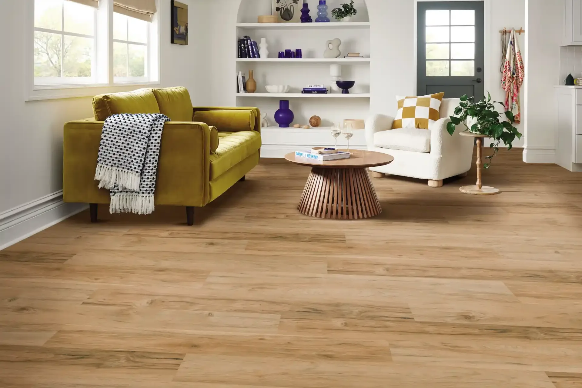 Warm luxury vinyl plank in a bright living room — flooring for Haines City, FL homes
