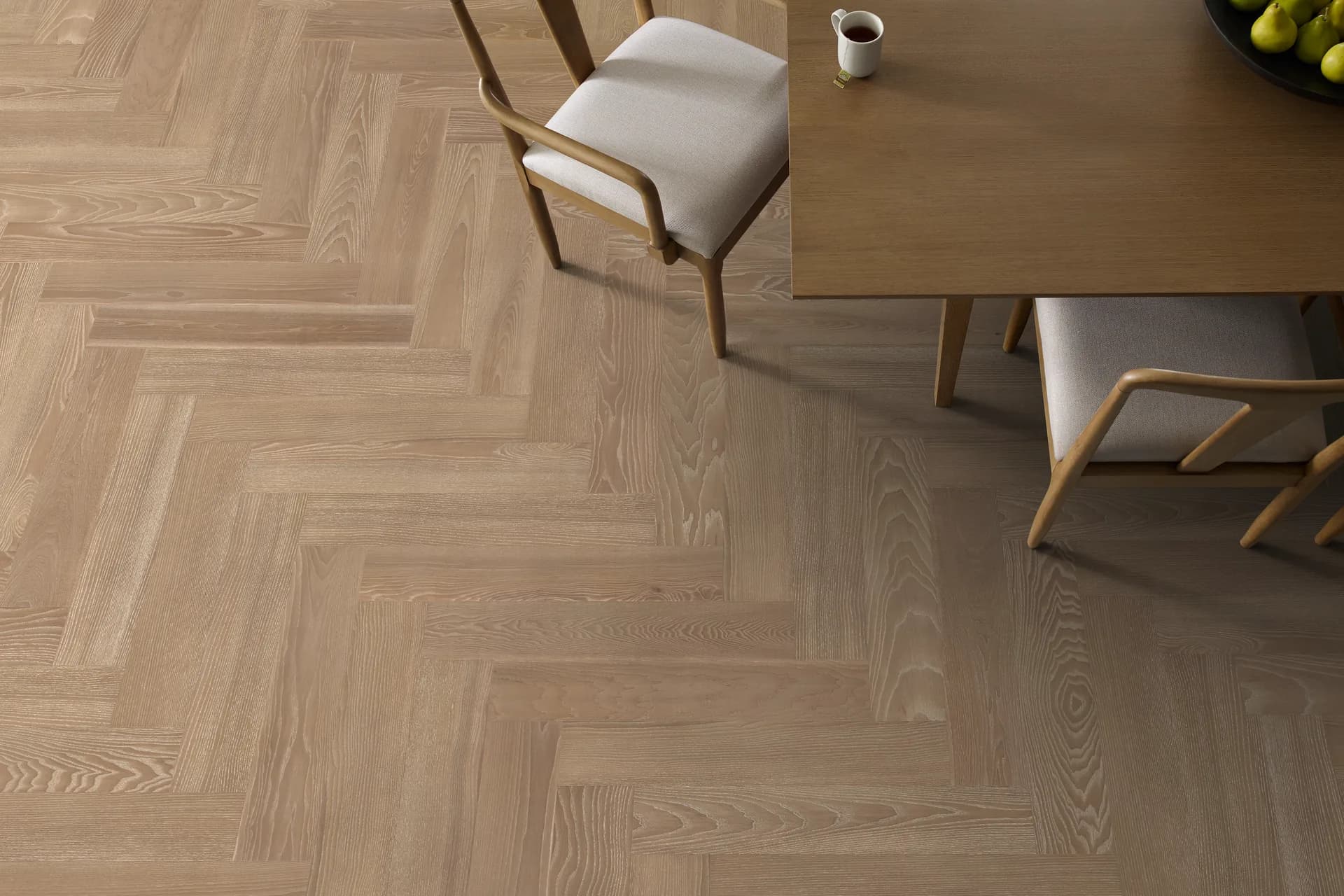 European ash herringbone hardwood in a sunlit dining room — hardwood flooring for Winter Haven, FL