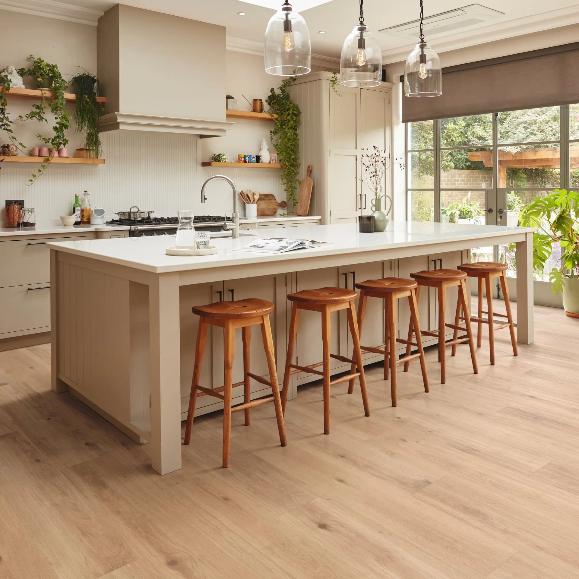 Karndean luxury vinyl plank running through an open kitchen with a long island. Karndean dealer in Winter Haven, FL