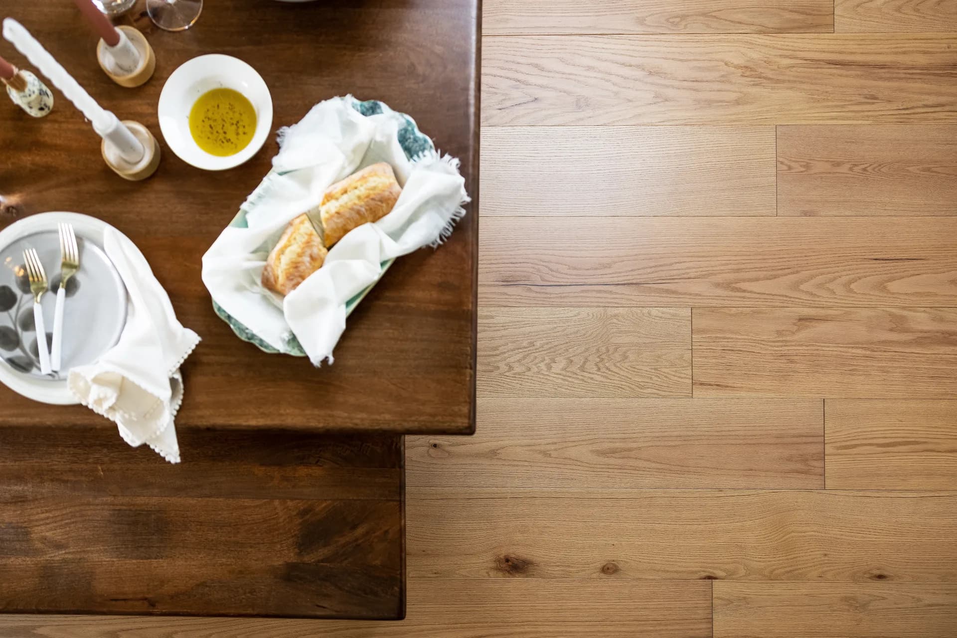 Warm oak hardwood floor beneath a wood dining table — flooring for Lake Alfred, FL homes