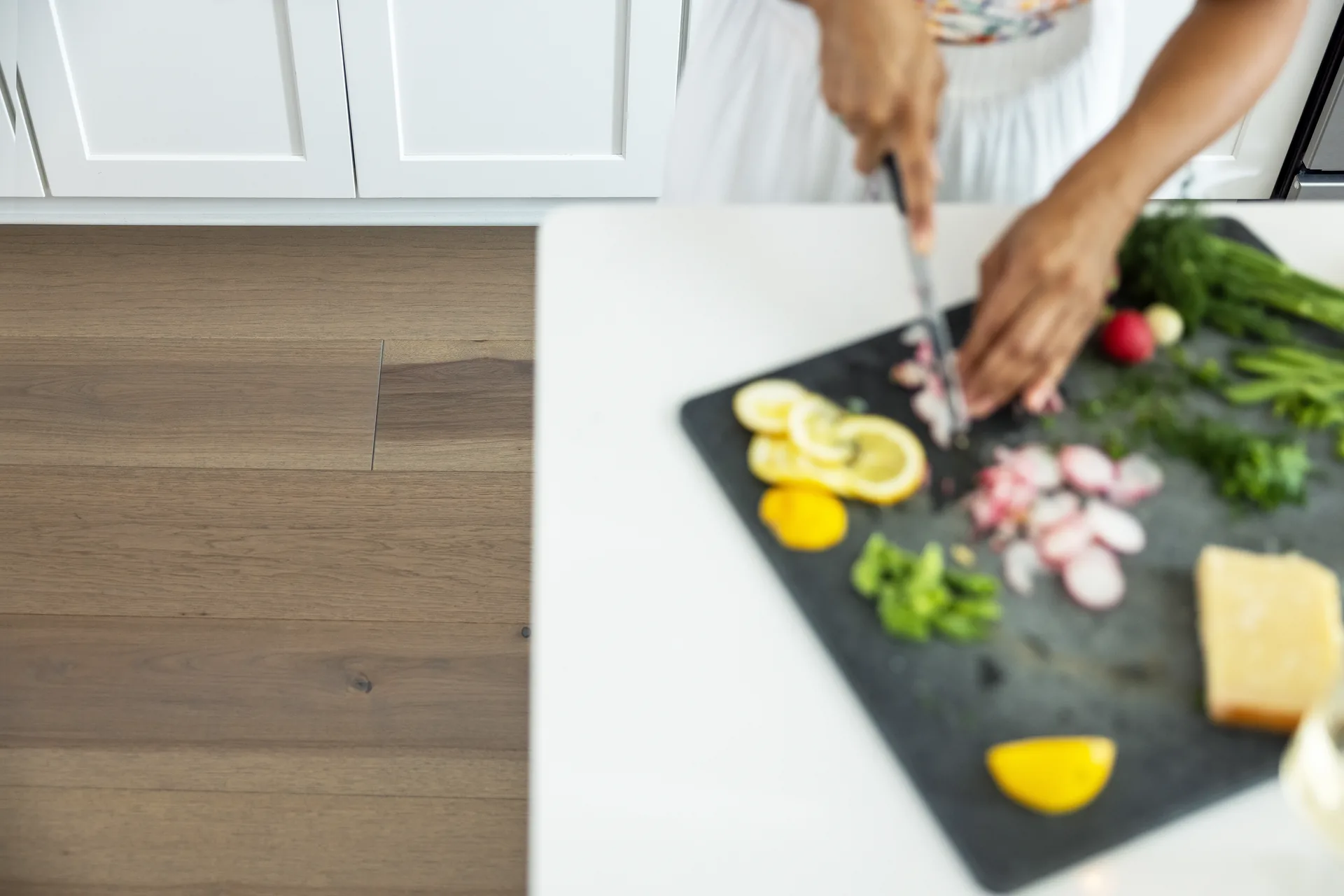Rich hickory hardwood planks in a kitchen prep scene — flooring for Lakeland, FL homes