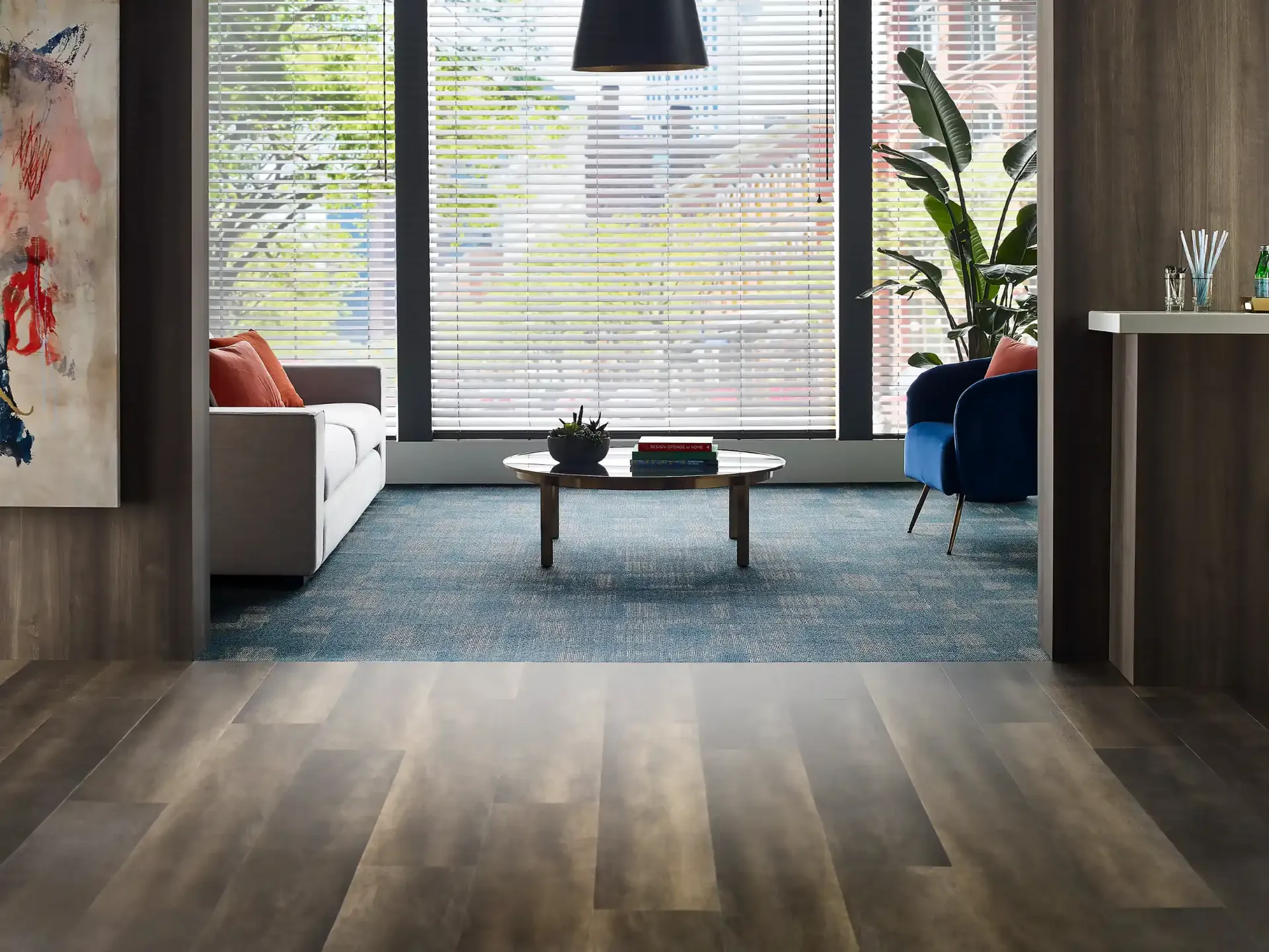 Philadelphia Commercial flooring in a residential lounge with blue accents. Carried by Blackburn's Interiors, Winter Haven, FL