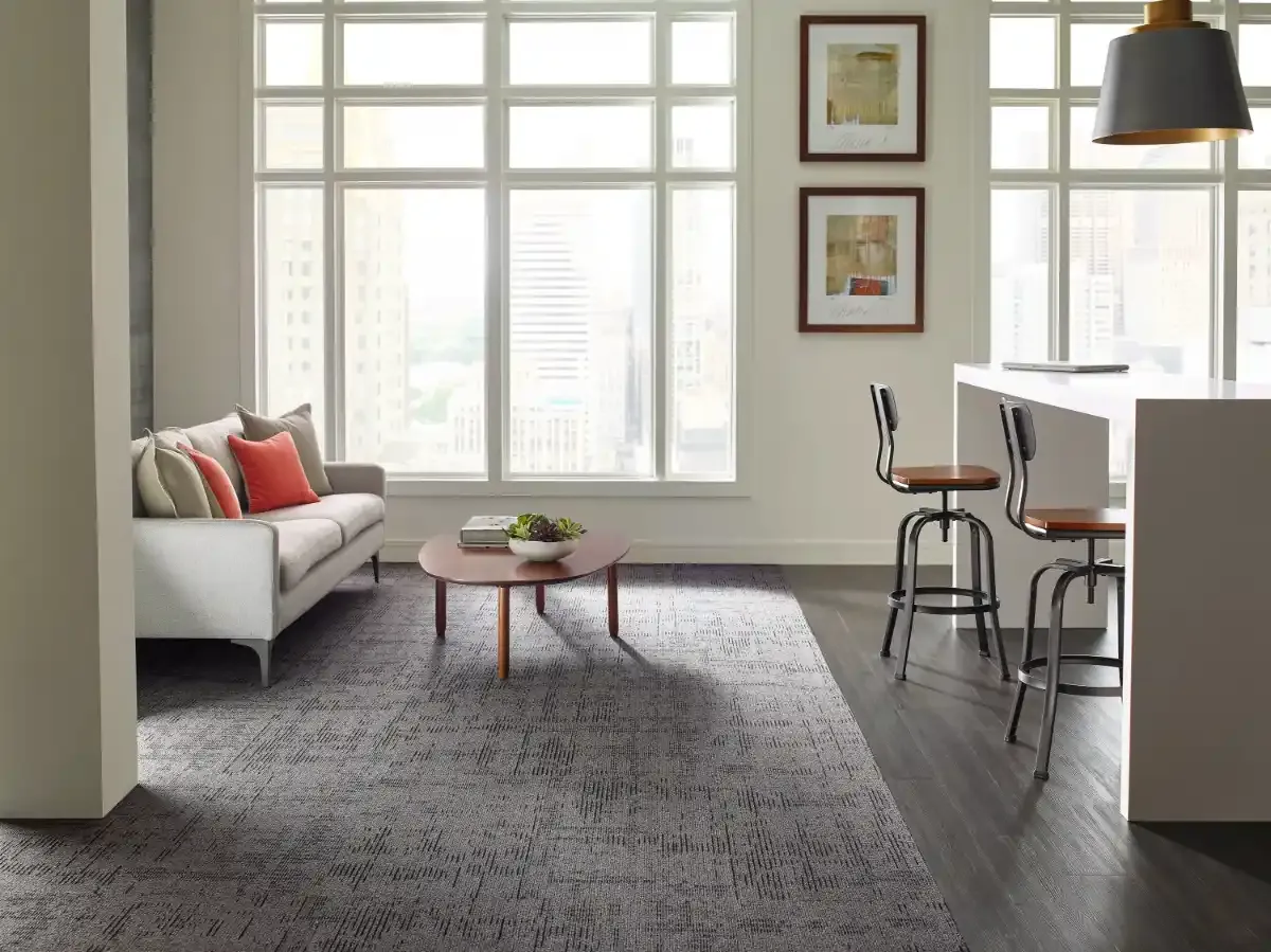 Philadelphia Commercial carpet tile in an office with floor-to-ceiling windows. Carried by Blackburn's Interiors, Winter Haven, FL