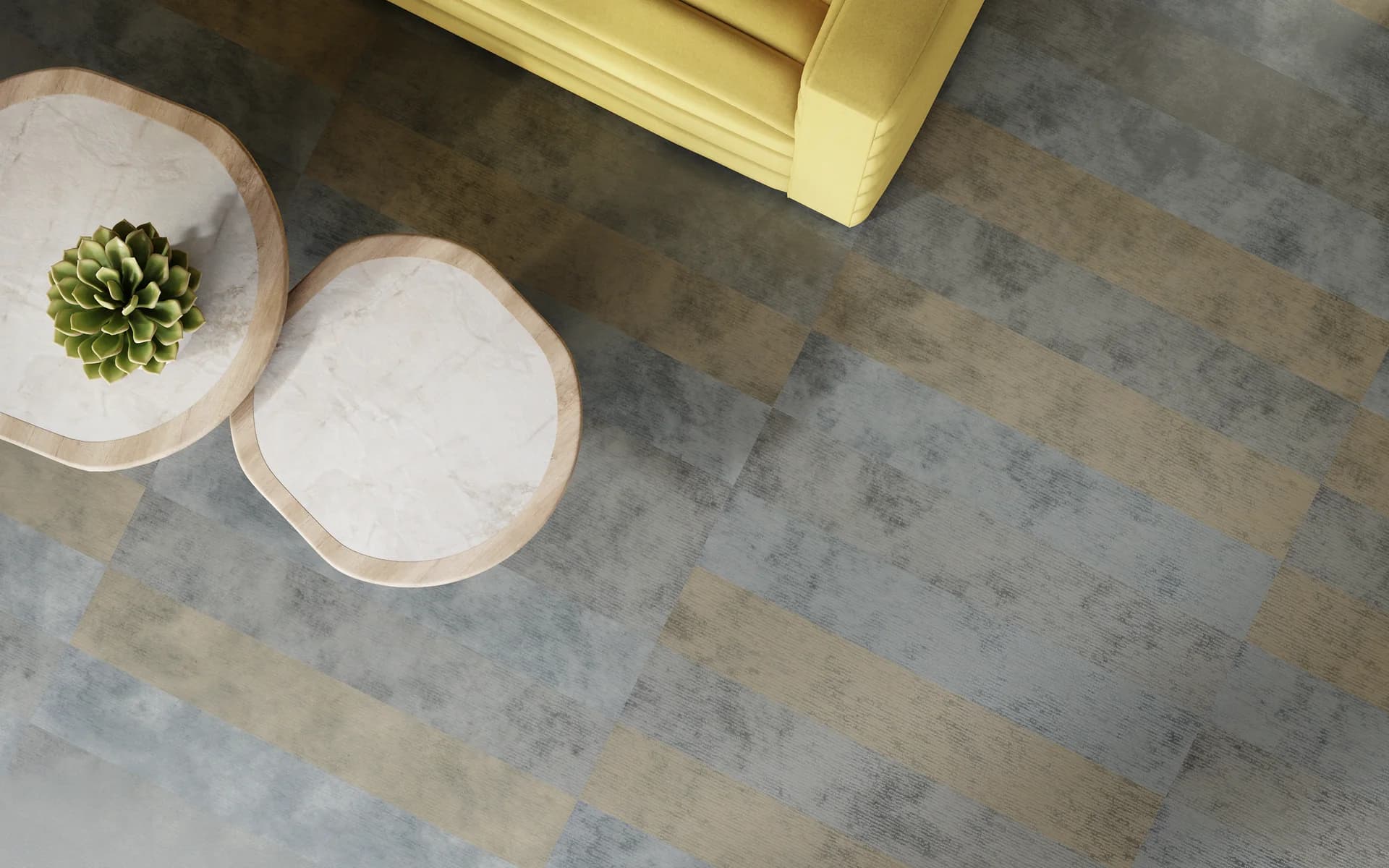 Philadelphia Commercial carpet tile in gray and tan concrete look planks in a lounge seating area. Carried by Blackburn's Interiors, Winter Haven, FL