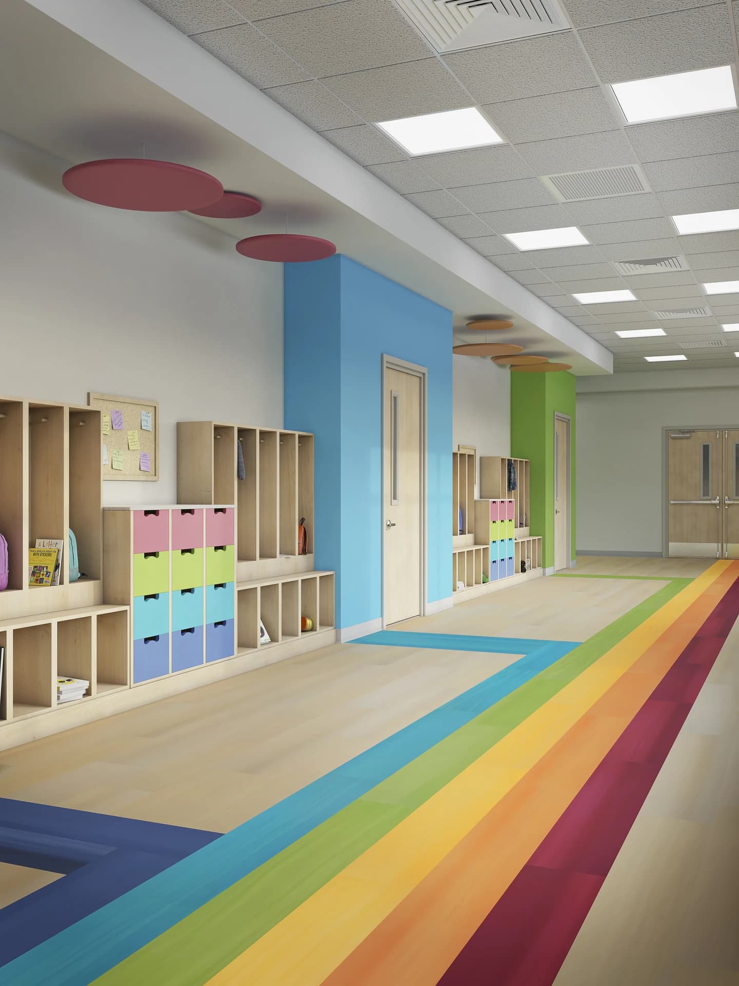 Philadelphia Commercial wood look plank flooring with rainbow stripes in a school hallway. Carried by Blackburn's Interiors, Winter Haven, FL