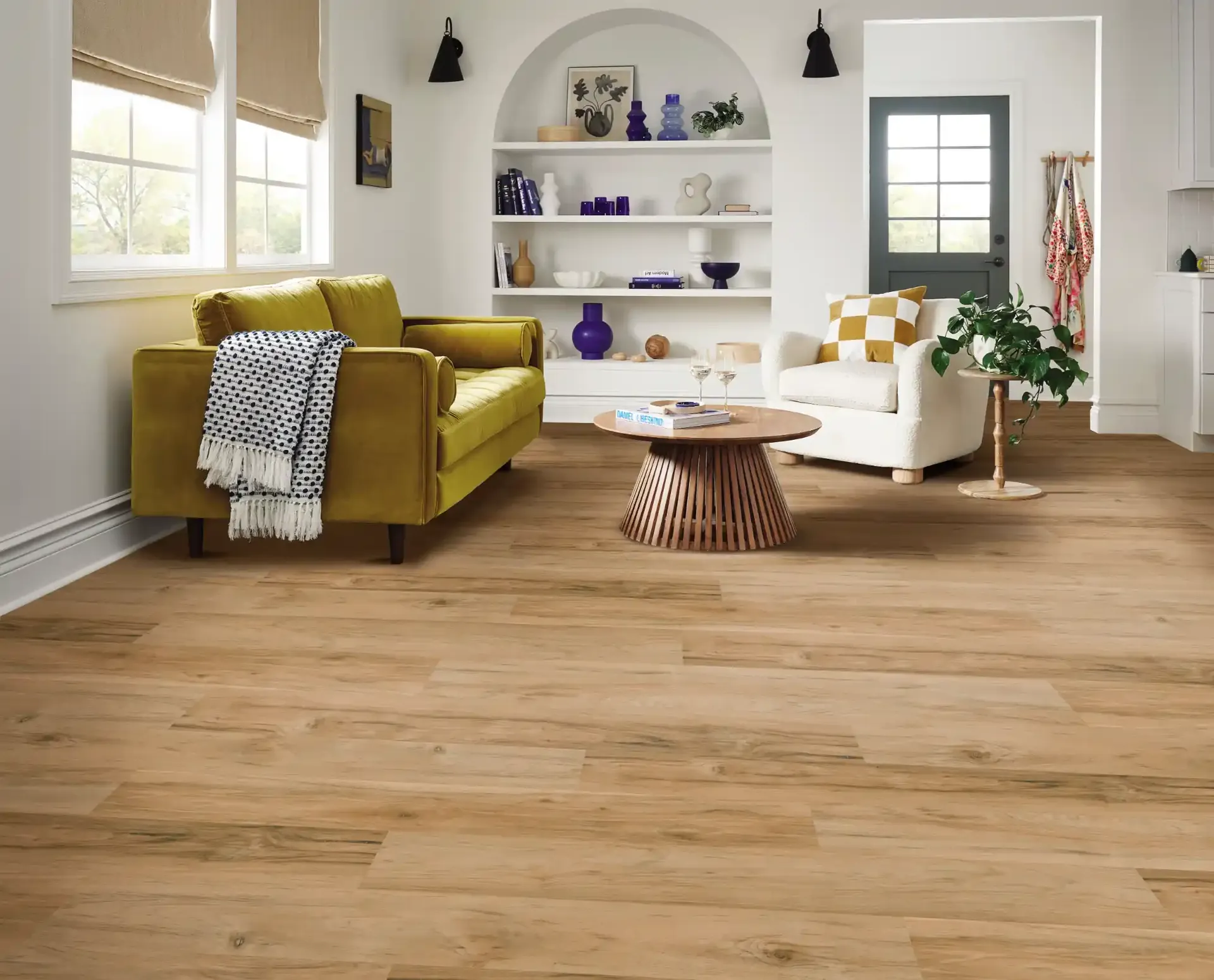 Shaw Ignite luxury vinyl in Golden Flare in a bright living room. Carried by Blackburn's Interiors, Winter Haven, FL