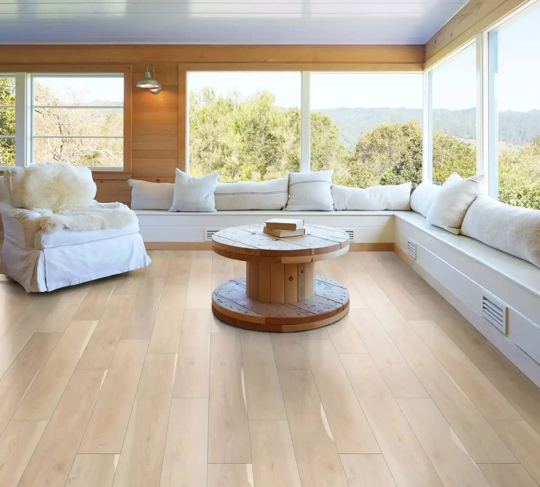 Shaw Pantheon HD Plus luxury vinyl in Alabaster by a window seat. Carried by Blackburn's Interiors, Winter Haven, FL
