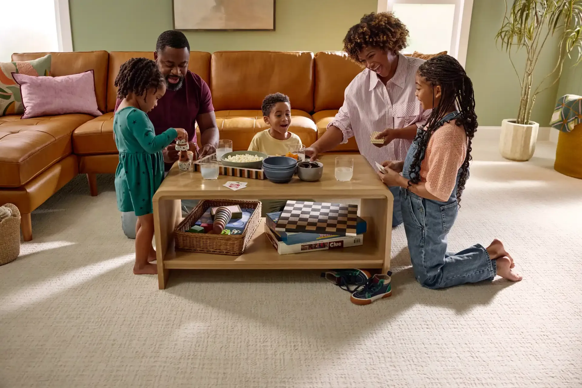 A family playing on Shaw Tailored Craft carpet in Oxford. Carried by Blackburn's Interiors, Winter Haven, FL