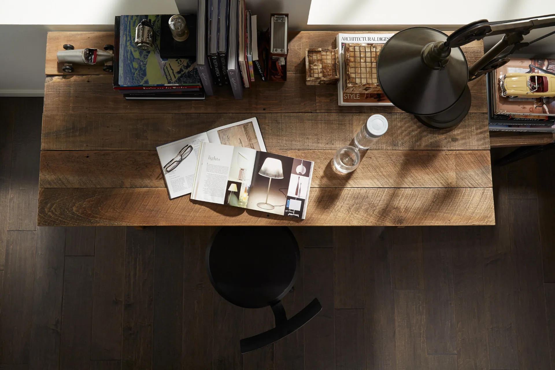 Shaw Yukon Maple II hardwood in Timberwolf under a desk, from above. Carried by Blackburn's Interiors, Winter Haven, FL