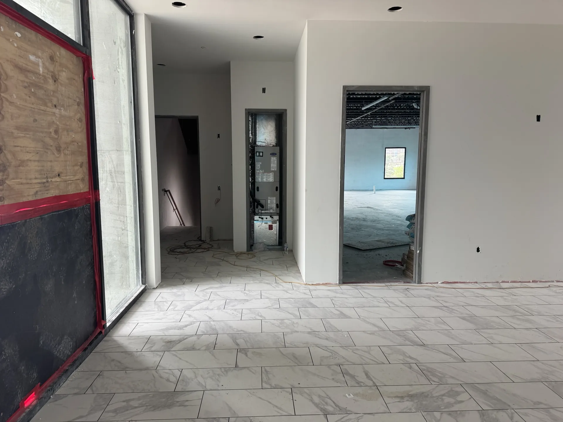 Marble-look Daltile Perpetuo porcelain tile installed by Blackburn's Interiors at Sand Lake Vista in Orlando, FL