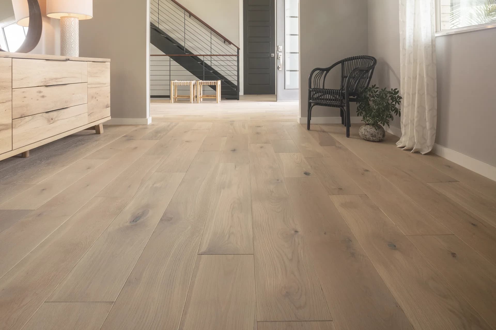 Wide-plank white oak hardwood in a bright entryway — flooring for Winter Haven, FL homes
