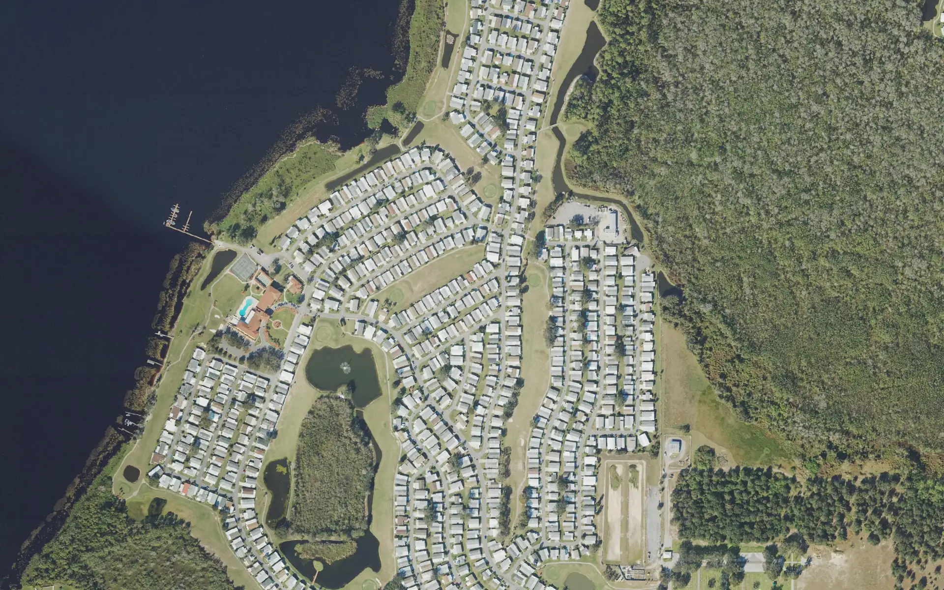 Aerial view of Four Lakes Golf Club along Lake Haines in Winter Haven, Florida