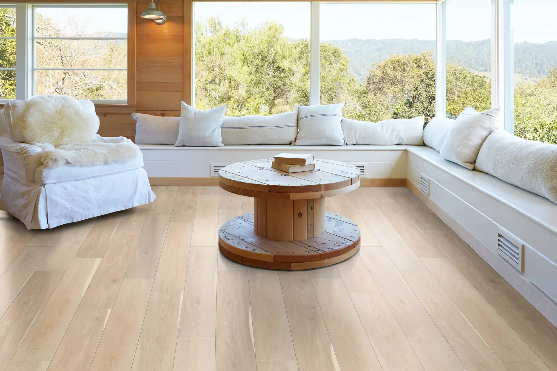 Pale luxury vinyl plank in a bright sunroom — flooring built for Florida homes, Winter Haven, FL