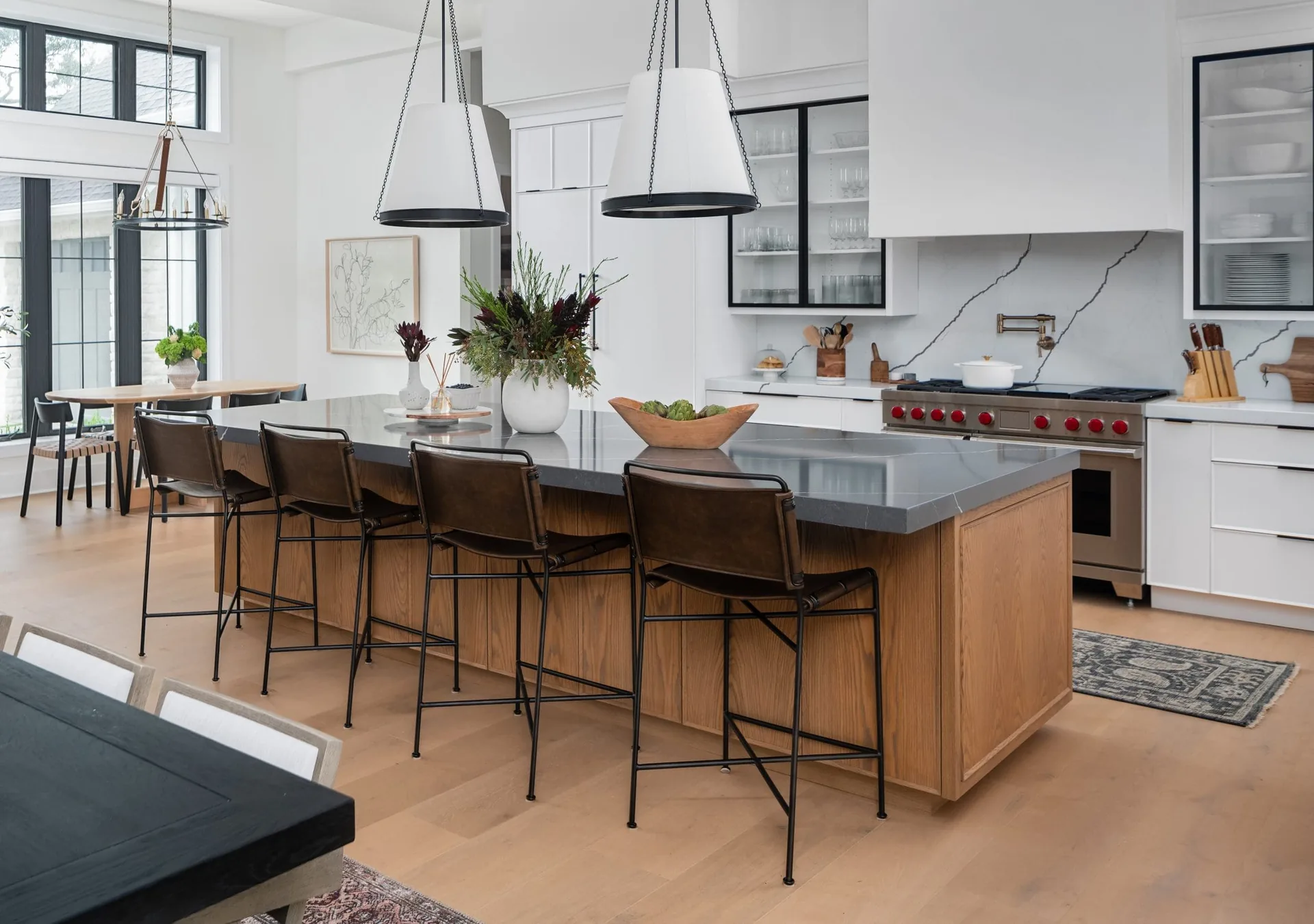 Pompeii Quartz Cemento waterfall island and countertops in a modern kitchen, from the Pompeii Quartz line we carry