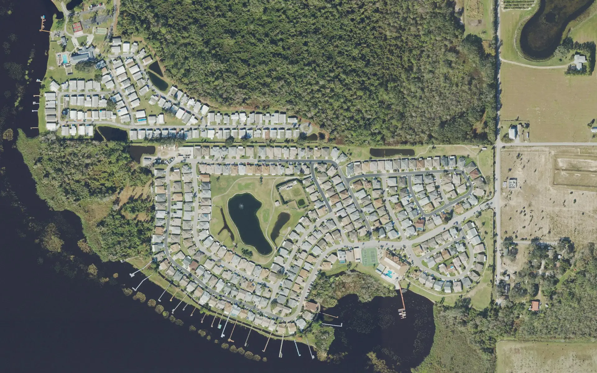 Aerial view of Sweetwater Golf and Tennis Club on Lake Henry in Haines City, Florida