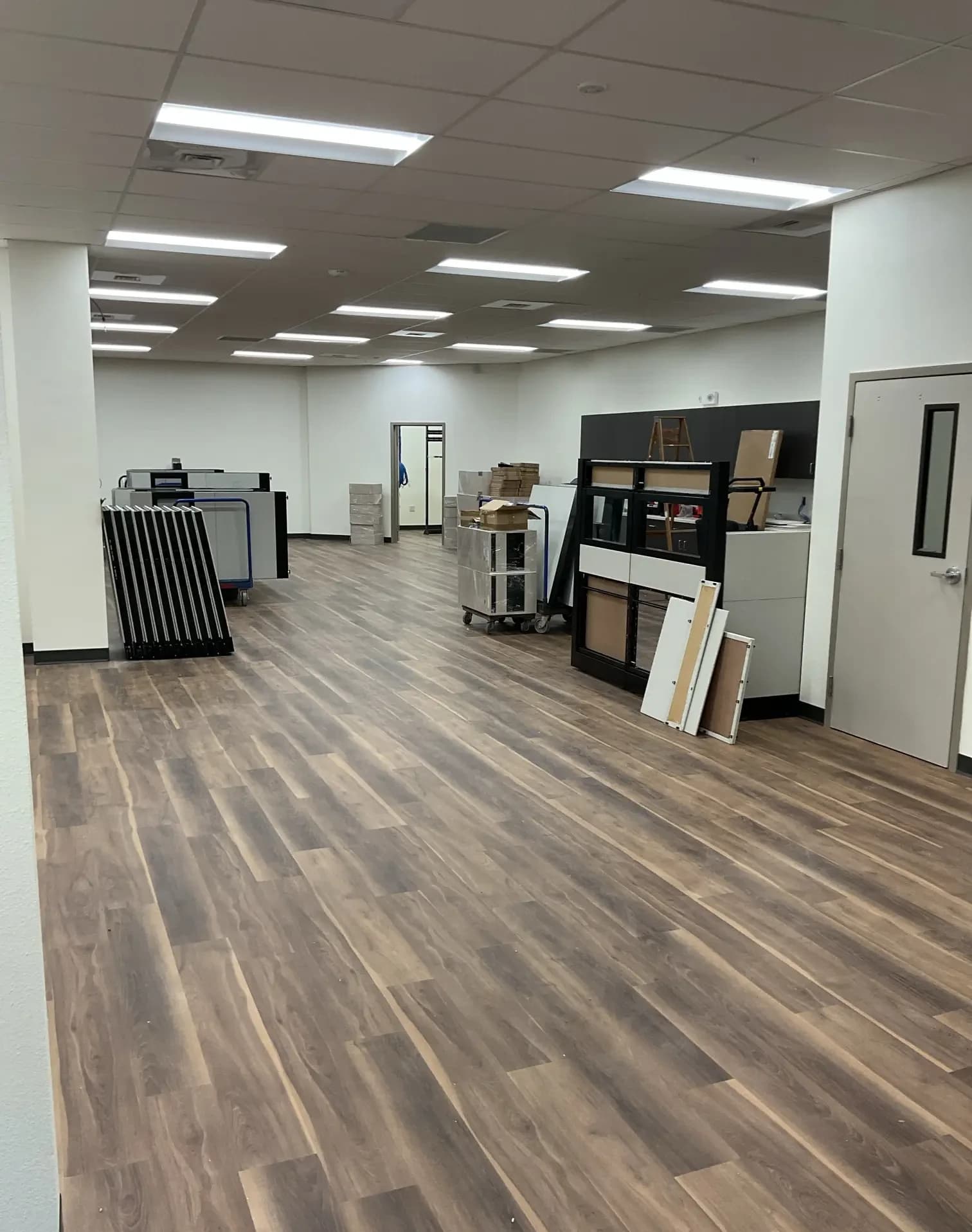 Wood-look flooring across an open office area at the DeSoto County Admin Building