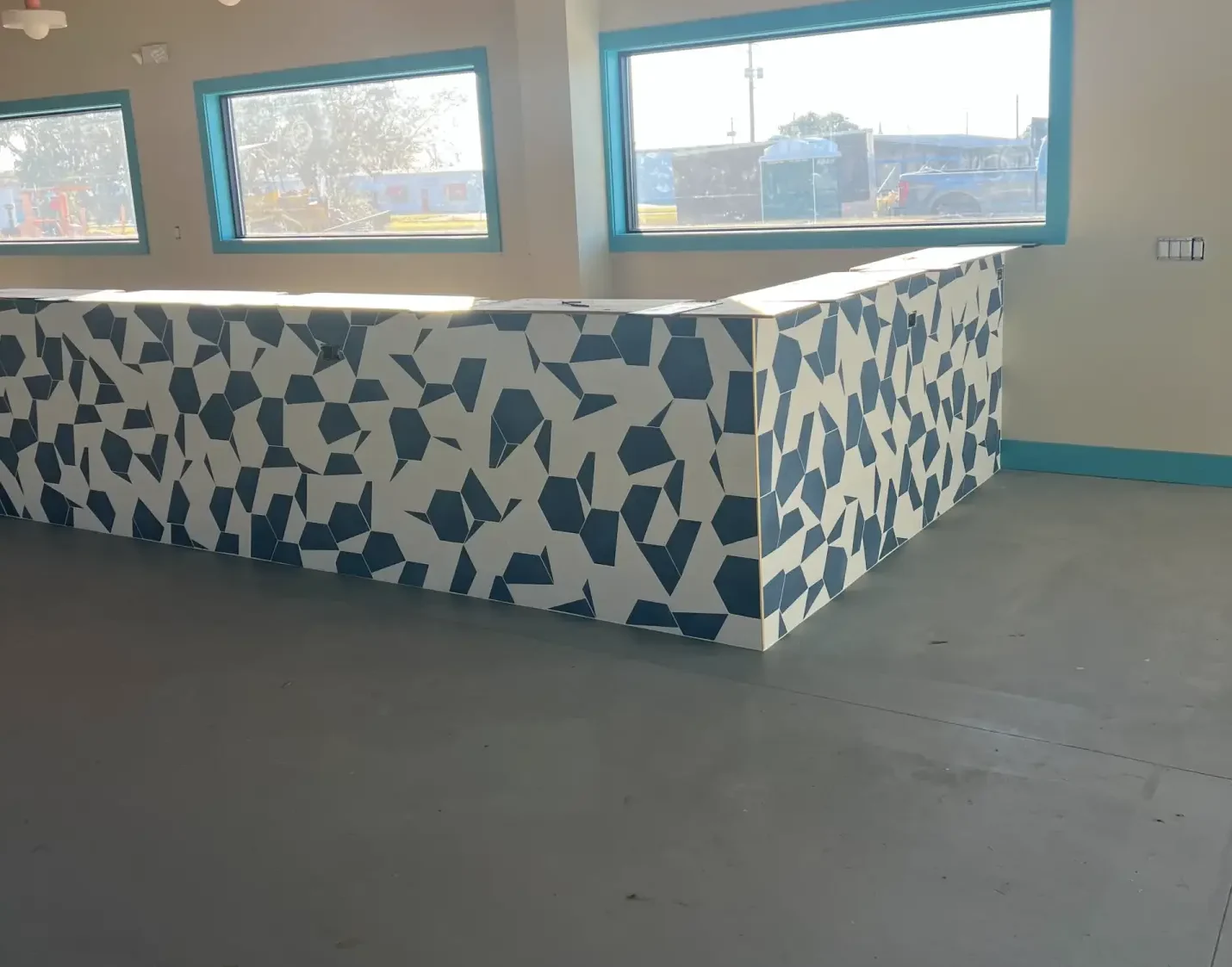 Navy and white 8-inch porcelain hex tile bar front installed by Blackburn's at Maritime Restaurant in Winter Haven, FL