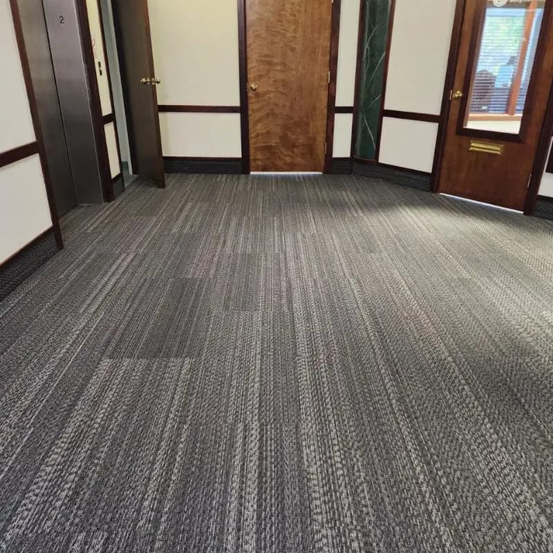 Striated gray carpet tile installed in the upstairs hallway of the Munn Park Building in downtown Lakeland, FL